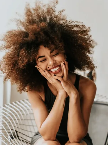 Smiling woman sitting on a chair